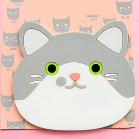Cat-shaped coaster with green eyes