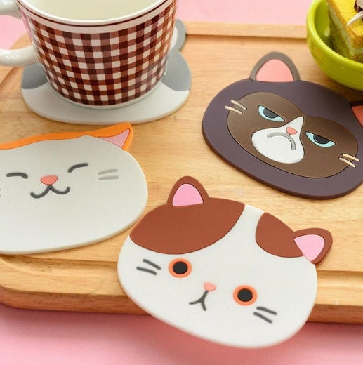 Cat-shaped coasters on a wooden surface - Neferpaws