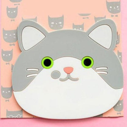 Cat-shaped coaster with green eyes