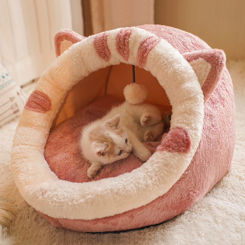 Pink cat-shaped pet bed with a kitten inside on a soft surface - Neferpaws