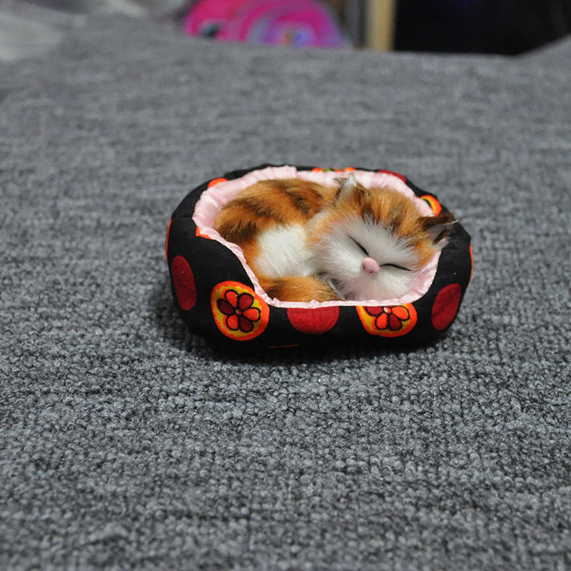 Will the small cat sleeping in a little bed toy