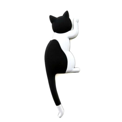 Black and white cat-shaped object on a white background