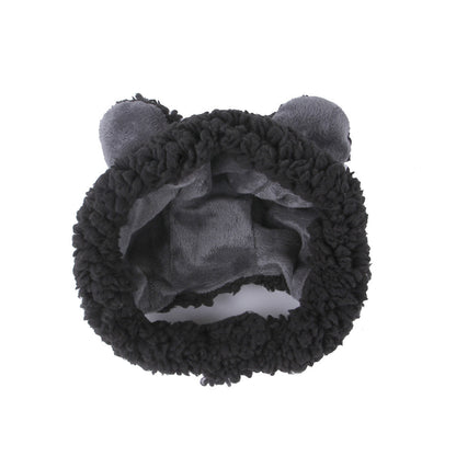 Black fuzzy headband with cat ears on a white background