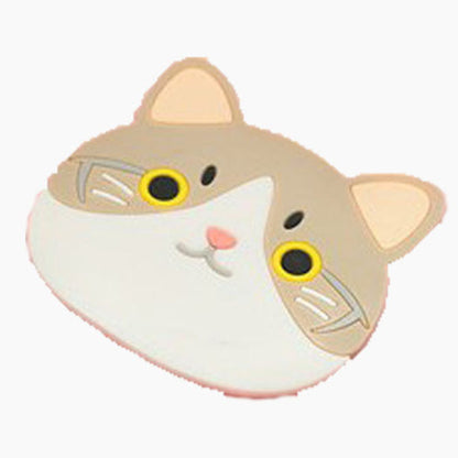 Cat-shaped cushion with yellow eyes on a white background
