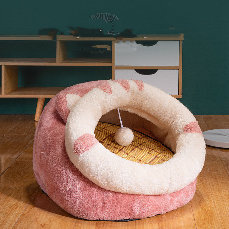 Pink and white pet bed with a ball on a wooden floor - Neferpaws