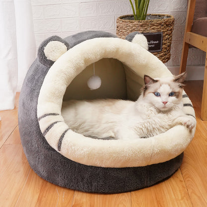 Cat lying in a gray and white cat bed on a wooden floor - Neferpaws