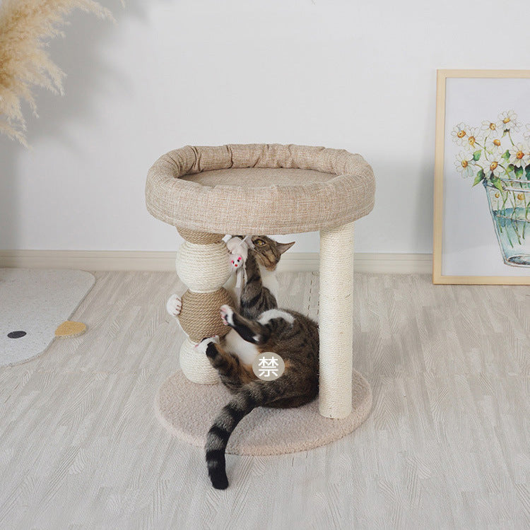 Cat playing on a multi-level cat tree in a room with a light wooden floor - Neferpaws