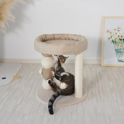 Cat playing on a multi-level cat tree in a room with a light wooden floor - Neferpaws